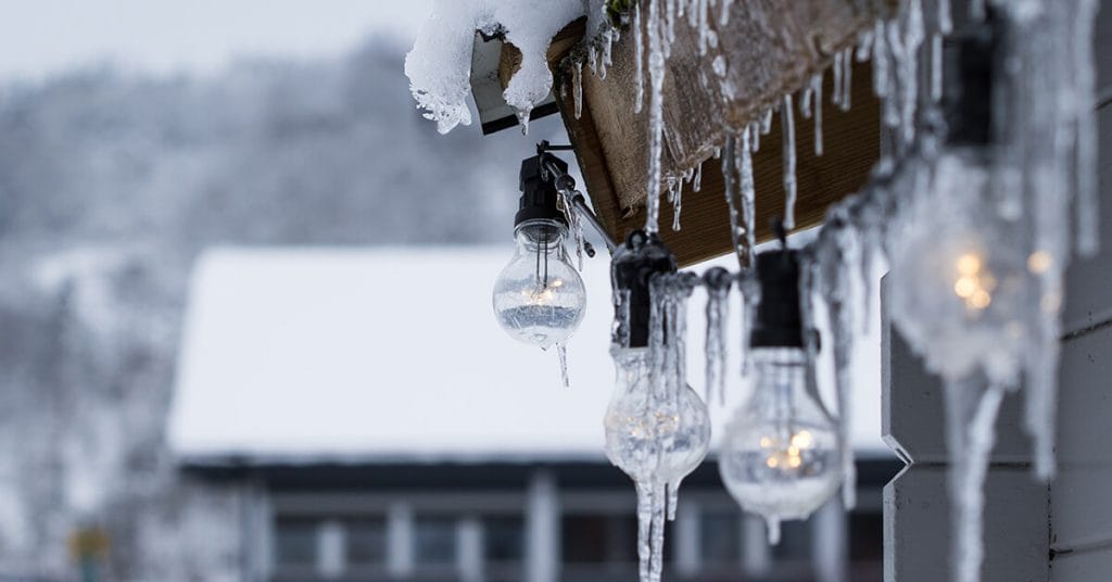 Edison bulbs strung on a home for sale